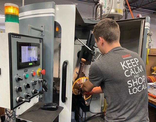 Circular saw blade mounted in a CNC saw grinder